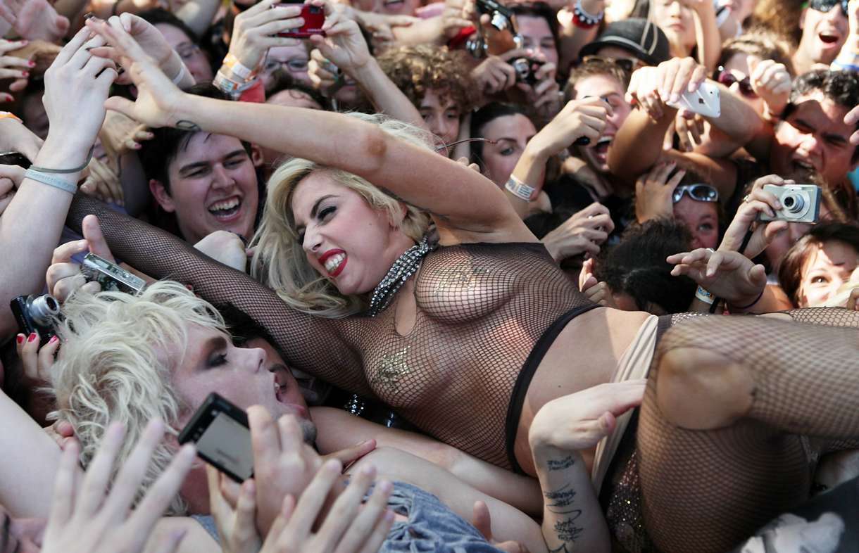 Lady Gaga crowd surfs and is groped. pic pic
